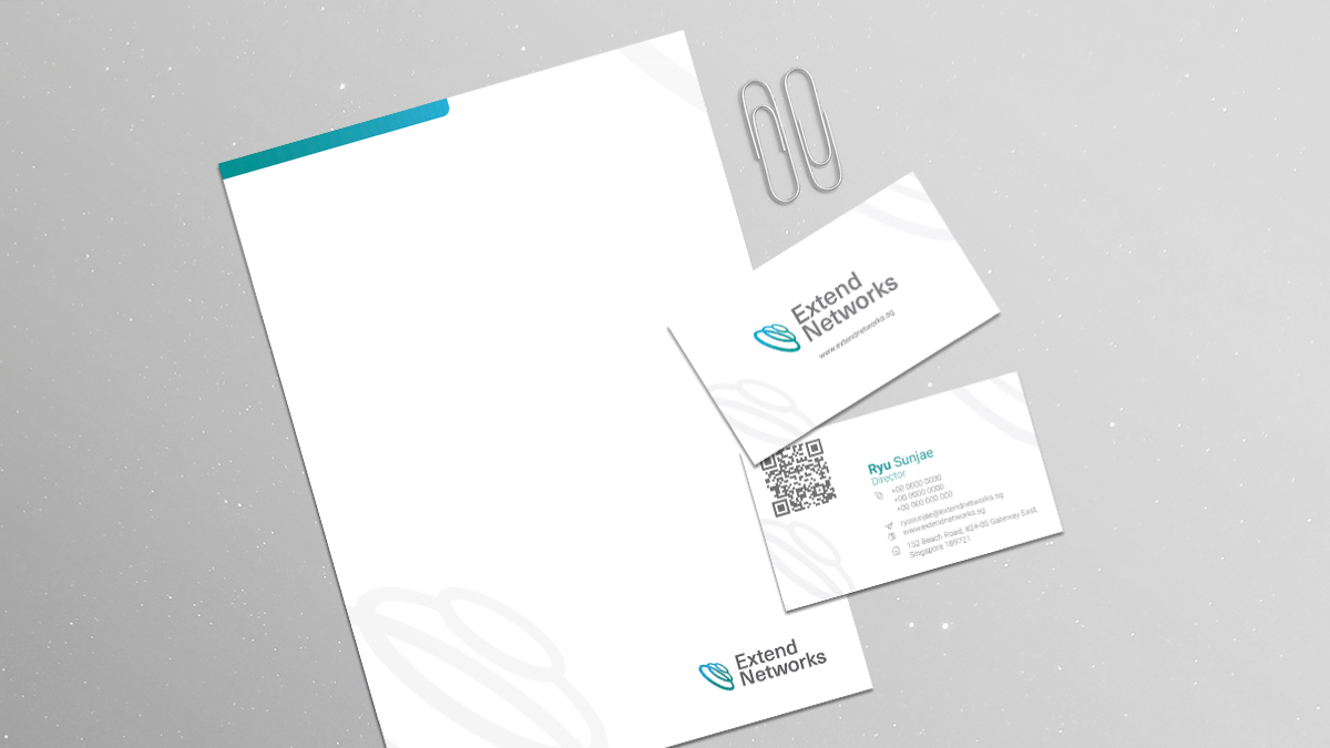 Extend Networks stationery set including a letterhead and two business cards on a light gray background. The designs feature the company logo and contact information