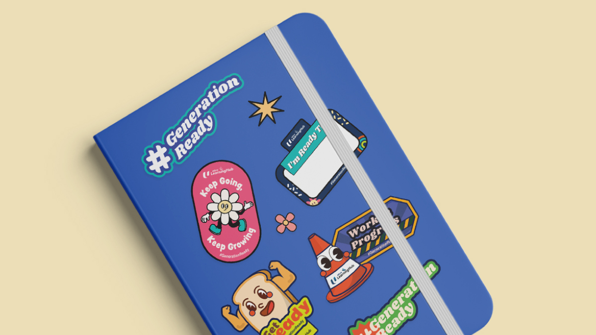 Blue notebook adorned with vibrant stickers featuring phrases like '#GenerationReady,' 'Keep Going, Keep Growing,' and 'Work in Progress,' illustrating creative brand engagement through personalized and motivational designs.